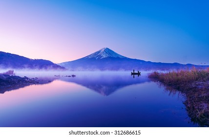 Mount Fuji During Twilight At Lake Kawaguchiko From Japan. People Fishing At Lake On Twilight On Fuji-san Background. 