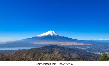 Mount Fuji and Lake Yamanaka in the blue sky                                - Shutterstock ID 1659122986