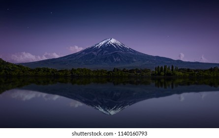 Mount Fuji Reflected In The Lake With A Purple Night Sky