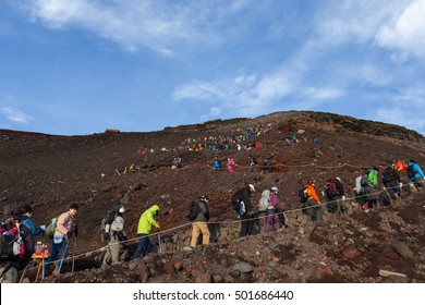 MOUNT FUJI, YAMANASHI, JAPAN - JULY 17, 2016: Crowds Of Climbers Are Climbing To The Summit Of Mount Fuji In Chubu Region, Honshu, Japan.