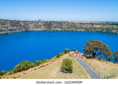 MOUNT GAMBIER, AUSTRALIA circa December 2019: Aerial view of tourists taking photos at the viewing platform of the Blue Lake in Mount Gambier, South Australia