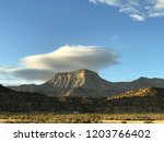 Mount Garfield in Clifton Colorado at sunset with beautiful blue skies and clouds