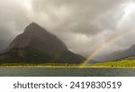 Mount Grinnell in Glacier National Park with Swiftcurrent Lake and double rainbow landscape