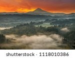 Mount Hood over foggy Sandy River Valley at Jonsrud Viewpoint during sunrise