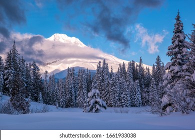 Mount Hood as seen during a winter sunset taken from Mirror Lake in the Mount Hood National Forest in Oregon during winter.