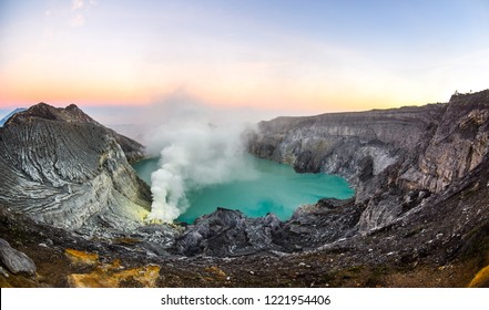 Mount Ijen Volcanic Crater At Sunrise With Sulfur Fog