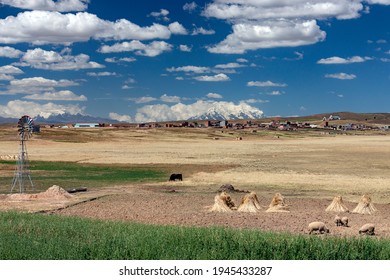 Mount Illimani (6100m) And Village (3800m) On The Altiplano Near La Paz In Bolivia, South America.