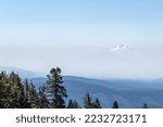 Mount Jefferson peaking out from a hazy Oregon Sky