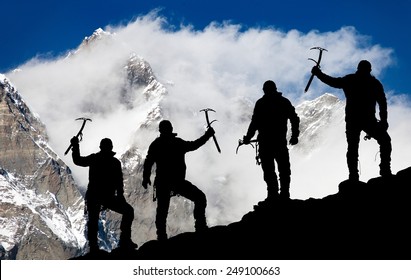 Mount Lhotse and silhouette of men with ice axe - way to everest base camp - Nepal 
