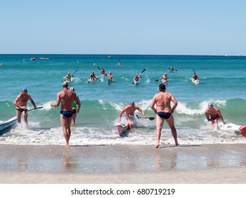 MOUNT MAUNGANUI, NEW ZEALAND - JANUARY 28; Men Involved In Canoe Racing Paddling Through Surf In Competitions At Mount Maunganui, Surf Lifesaving, January 28, 2012, At Mount Maunganui, New Zealand