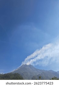 Mount Merapi, an active volcano in Central Java, Indonesia, is known for frequent eruptions and stunning views. At 2,930 meters, it attracts hikers and adventure tourists.