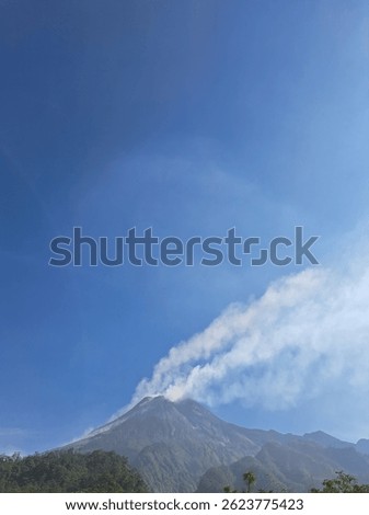 Mount Merapi, an active volcano in Central Java, Indonesia, is known for frequent eruptions and stunning views. At 2,930 meters, it attracts hikers and adventure tourists.