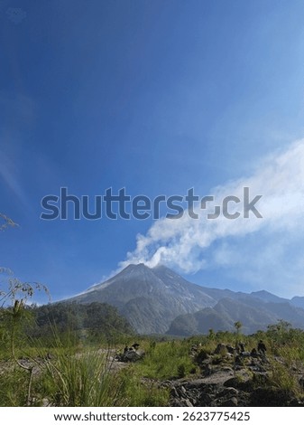 Mount Merapi, an active volcano in Central Java, Indonesia, is known for frequent eruptions and stunning views. At 2,930 meters, it attracts hikers and adventure tourists.