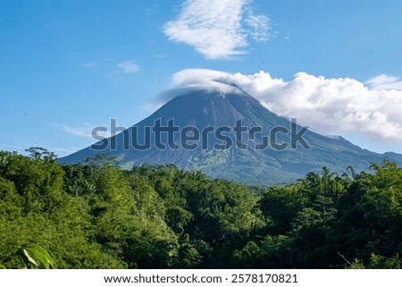 Mount Merapi peak with lenticular clouds, the most active stratovolcano in Indonesia and has erupted regularly since 1548.