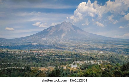 Mount Merapi - views of active volcanoes in central Java with bright blue skies
