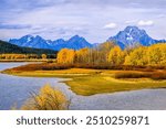 Mount Moran and the Teton Range, on the Snake River at Oxbow Bend in the beautiful colorful fall colors at the Grand Teton National Park, Wyoming, USA 