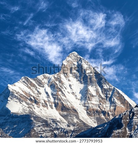 mount Nanda Devi peak with beautiful clouds, one of the best mounts in Indian Himalayas, seen from Joshimath Auli, Uttarakhand, mount Nanda Devi India himalaya mountain, panoramic view
