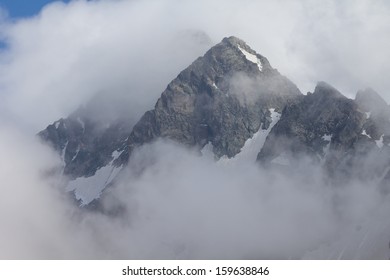 mount peak in a clouds - Powered by Shutterstock