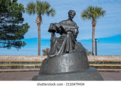 MOUNT PLEASANT, SC, USA - JANUARY 20, 2022: The War Memorial In Waterfront Park Depicts A Grieving Woman Holding A Folded American Flag To Her Breast With Her Right Arm Resting On A Battle Cross.