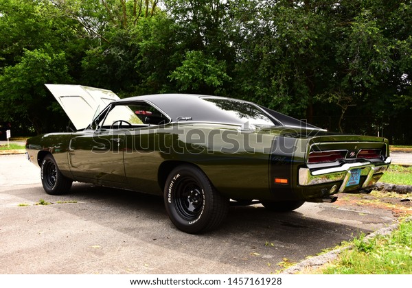 Mount Pleasant, Wisconsin / USA -\
July 21, 2019: 1969 Dodge Charger R/T with 440 Magnum dark green at\
local car show.  Shown in three quarter rear view. \
