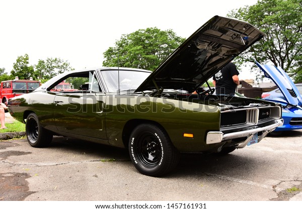 Mount Pleasant, Wisconsin / USA - July 21, 2019:\
Three quarter front view of a green 1969 Dodge Charger R/T with 440\
Magnum at local car show.\
