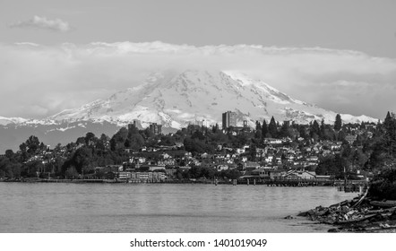 Mount Rainers Seems To Be Right On Top Of A Neighborhood In Tacoma, Washington.