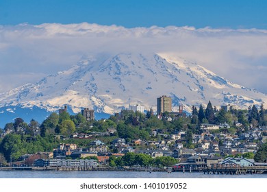 Mount Rainers Seems To Be Right On Top Of A Neighborhood In Tacoma, Washington.