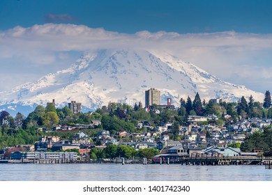 Mount Rainers Seems To Be Right On Top Of A Neighborhood In Tacoma, Washington.