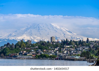 Mount Rainers Seems To Be Right On Top Of A Neighborhood In Tacoma, Washington.