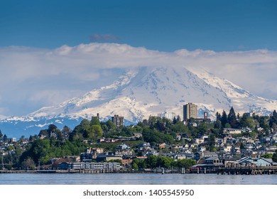 Mount Rainers Seems To Be Right On Top Of A Neighborhood In Tacoma, Washington.