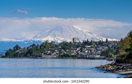 Mount Rainers Seems To Be Right On Top Of A Neighborhood In Tacoma, Washington.