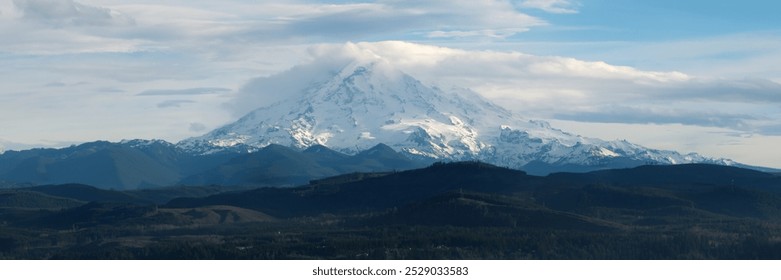 Mount Rainier Covered in Snow with Cloudy Skies - Powered by Shutterstock