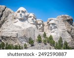 Mount Rushmore in the Black Hills of South Dakota against a clear sky.