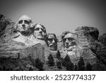 Mount Rushmore in the Black Hills of South Dakota against a clear sky.