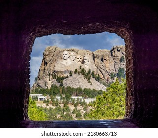 Mount Rushmore National Memorial though the Doane Robinson Tunnel on Iron MountaIn Road part of the Peter Norbeck Scenic National Byway in the Black Hills of South Dakota USA