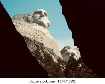 Mount Rushmore through a cavern revealing Washington and Lincoln (warm)  