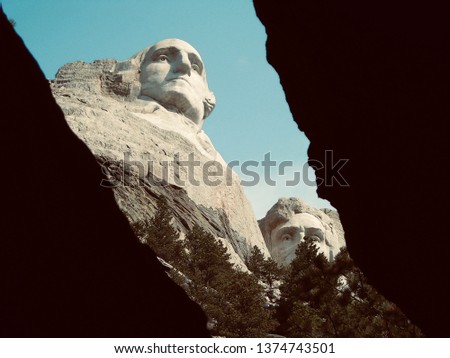 Mount Rushmore through a cavern revealing Washington and Lincoln (warm)  