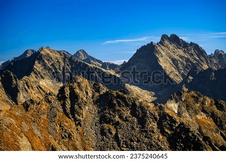 The Mount Rysy, Lomnica and Wysoka. Autumn landscape of the High Tatras. One of the most popular travel destination in Poland and Slovakia. Sunny October day in the mountains. [[stock_photo]] © 