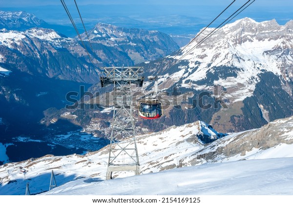 mount\
titlis, Switzerland - January 02, 2022 : means of transportation to\
the top of the titlis using cable car technology that can rotate so\
that we can enjoy the scenery during the\
trip.