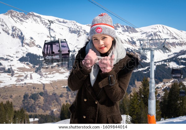 Mount Titlis,\
Switzerland - March 27, 2019 : Tourist woman happy on Les\
Diablerets in Swiss Alps,\
Switzerland