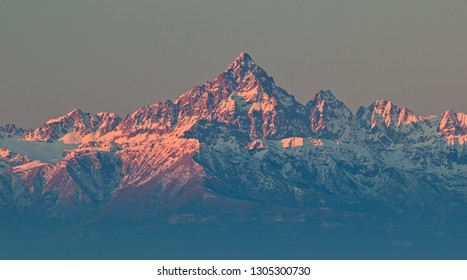 Mount Viso, Alps Peak, Seen From Superga, Turin, Piedmont, During A Winter Sunrise With Snow And Pink Light On The Glaciers