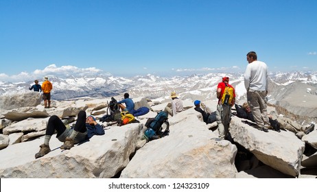 MOUNT WHITNEY, CA - JUNE 30: Hikers rest after a strenuous climb on June 30, 2010, on the summit of Mount Whitney. In 2009 ca. 25,000 people summited the highest peak in the continental United States.