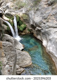 A Mountain Azure River Among Stones With Waterfalls