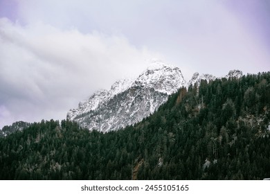 Mountain behind the forest with clouds 