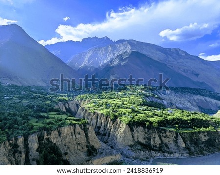 mountain 🏔️ between water way cloud green nature 