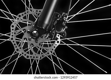 Mountain bicycle photography in studio. Bike wheel with disc brakes. Bike part.
