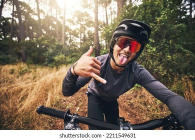 Mountain bike, cycling and fitness with a man gesture a shaka hand sign while training or exercise in Brazil nature. Portrait of a professional male sports athlete doing cardio ednurance in a forest - Powered by Shutterstock