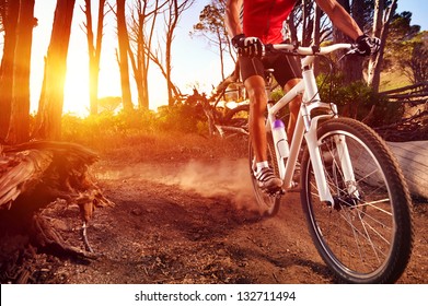 Mountain Bike cyclist riding single track at sunrise healthy lifestyle active athlete doing sport - Shutterstock ID 132711494
