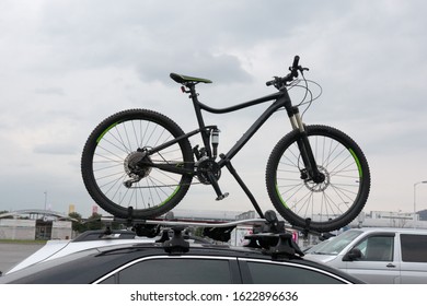 Mountain Bike Fixed On The Roof Of A Car.