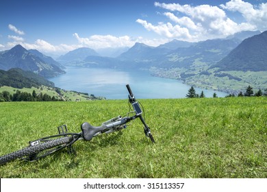 Mountain Bike Lies On The Green Of The Mountain Resort Buergenstock At Lake Lucerne.